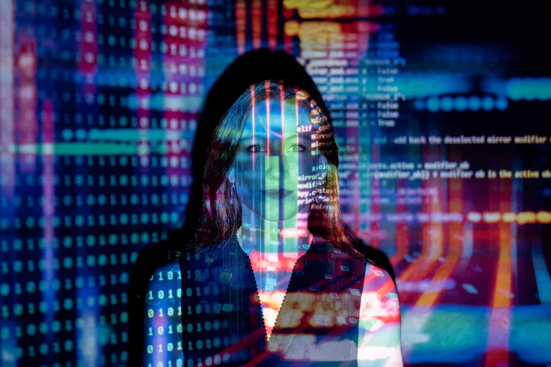 code projected over woman